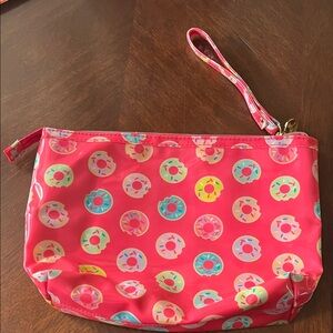 Dabney Lee pink wristlet with printed donuts. In excellent condtion